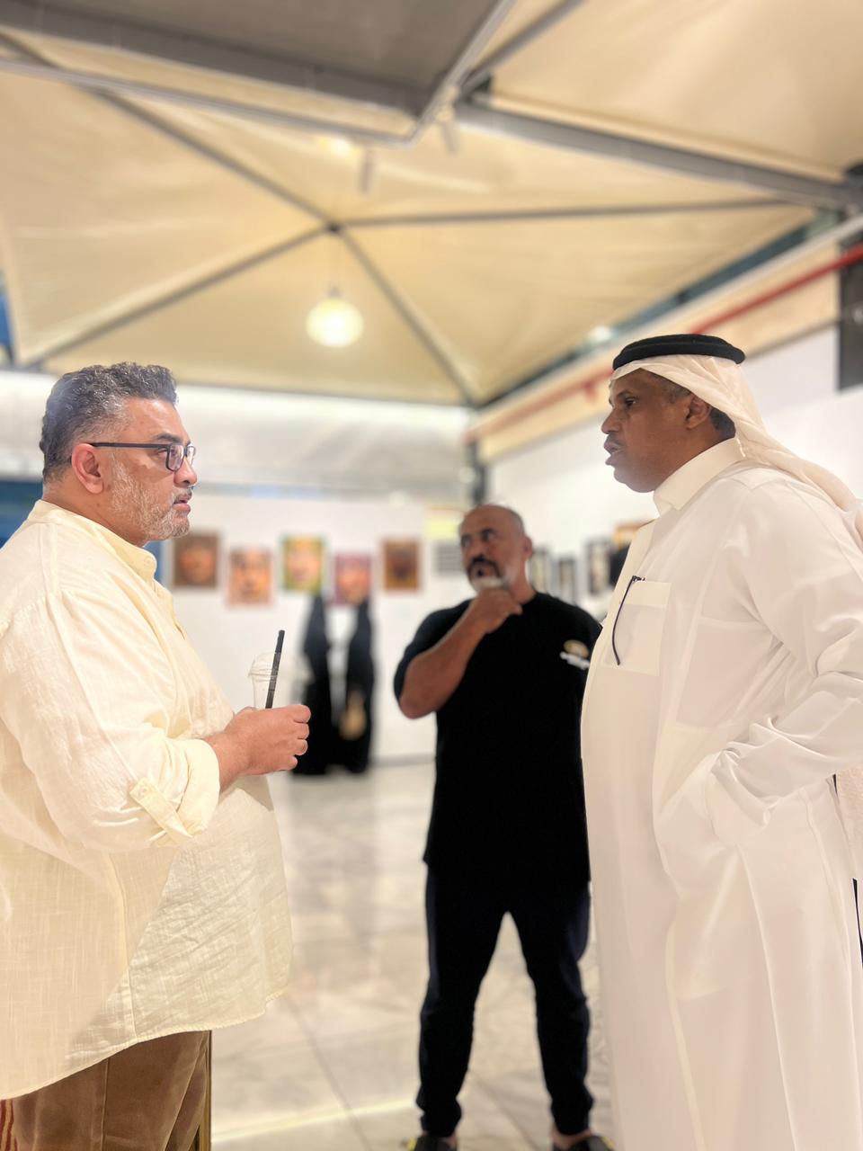 Artists in conversation inside the exhibition pavilion