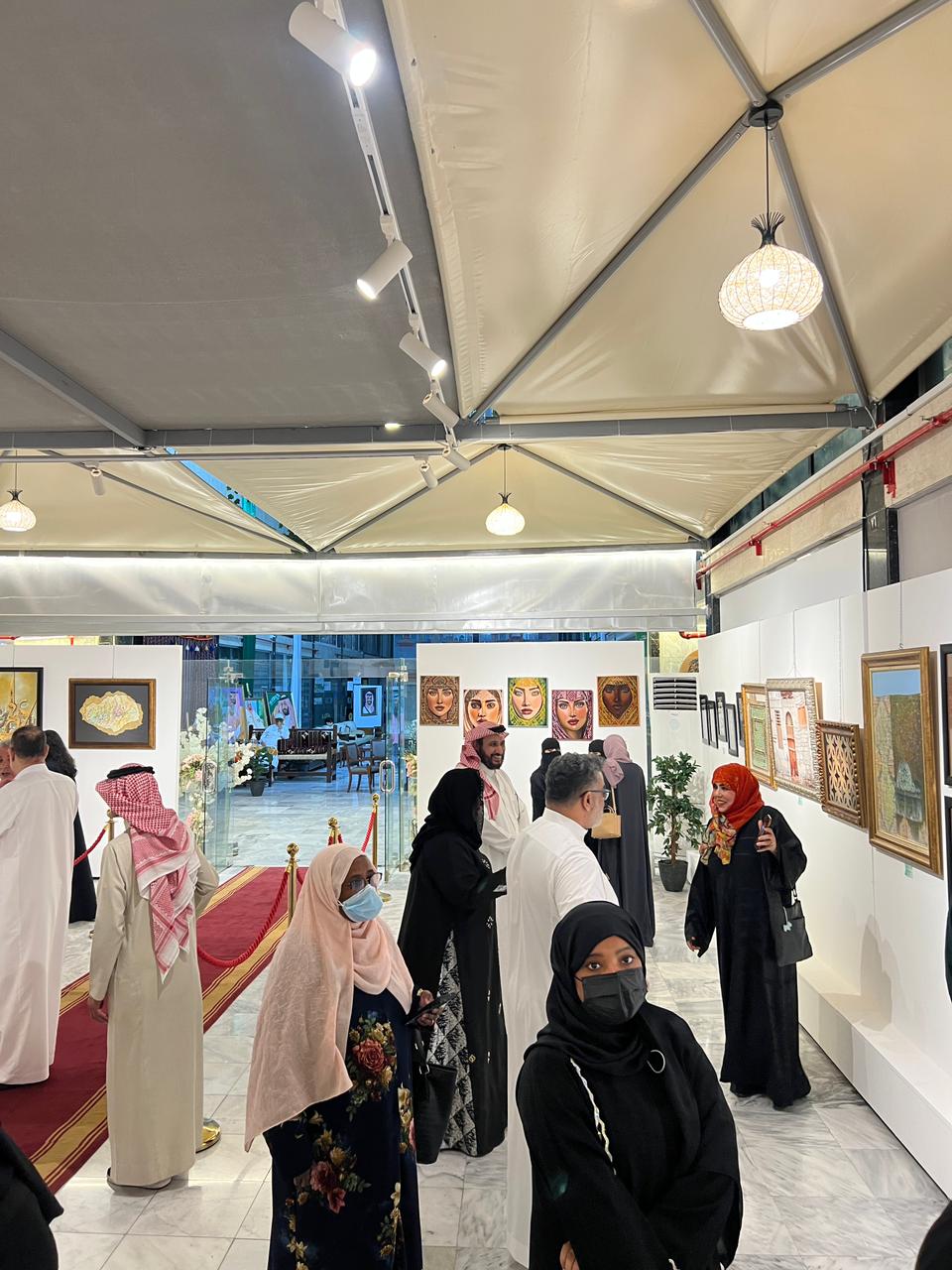 Exhibition hall with framed calligraphy and portrait works