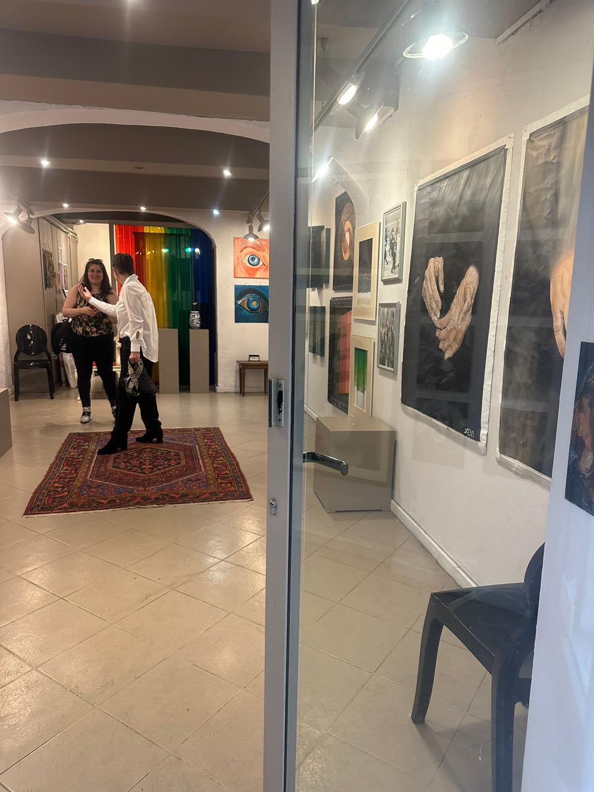Guests greeting each other at an Art Voyage opening