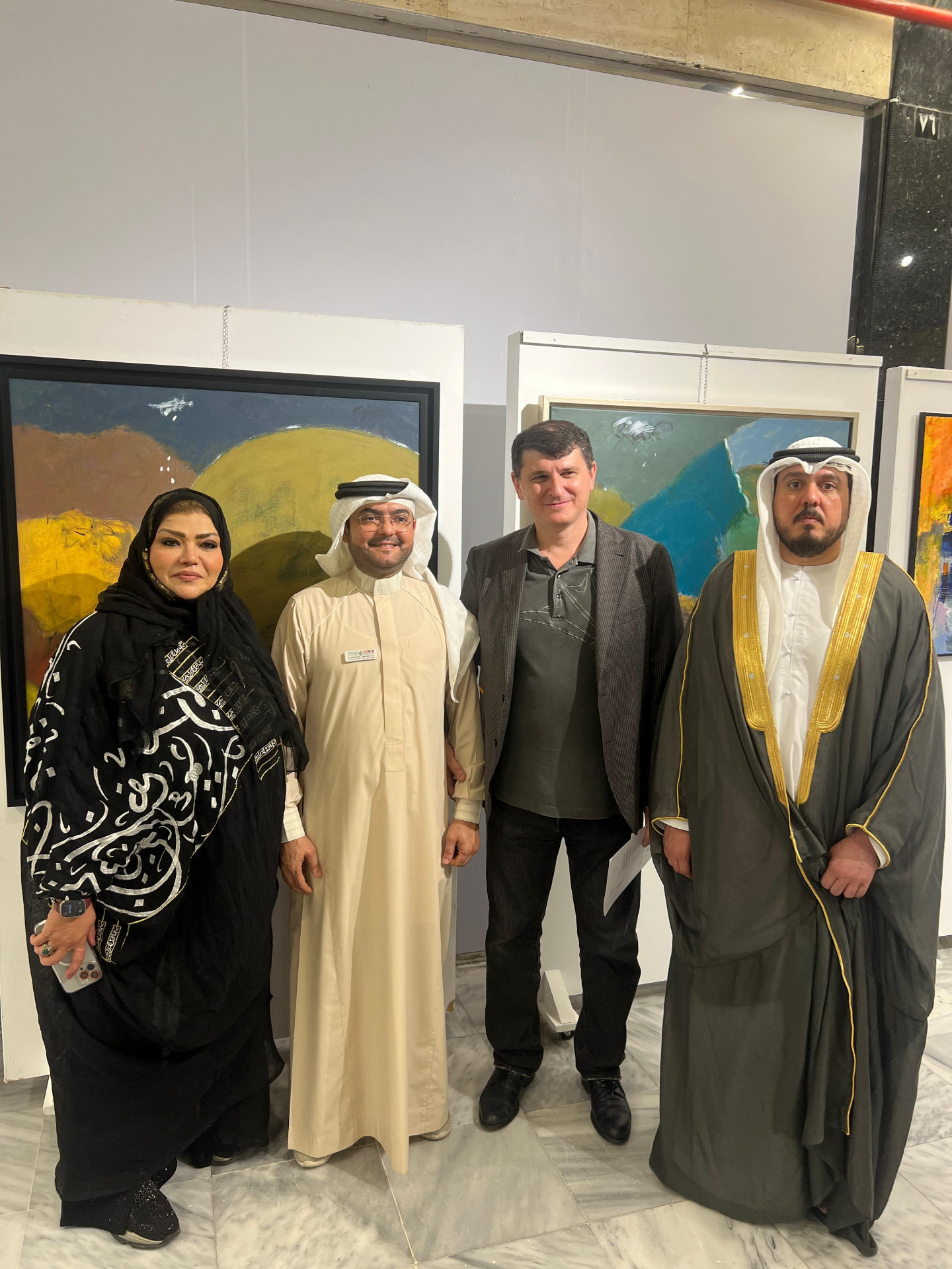Guests viewing paintings during Jeddah Art Echo