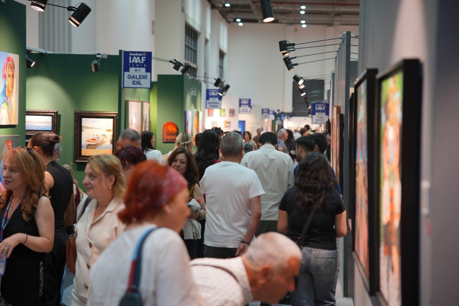 Visitors browsing gallery booths at IAAF Izmir