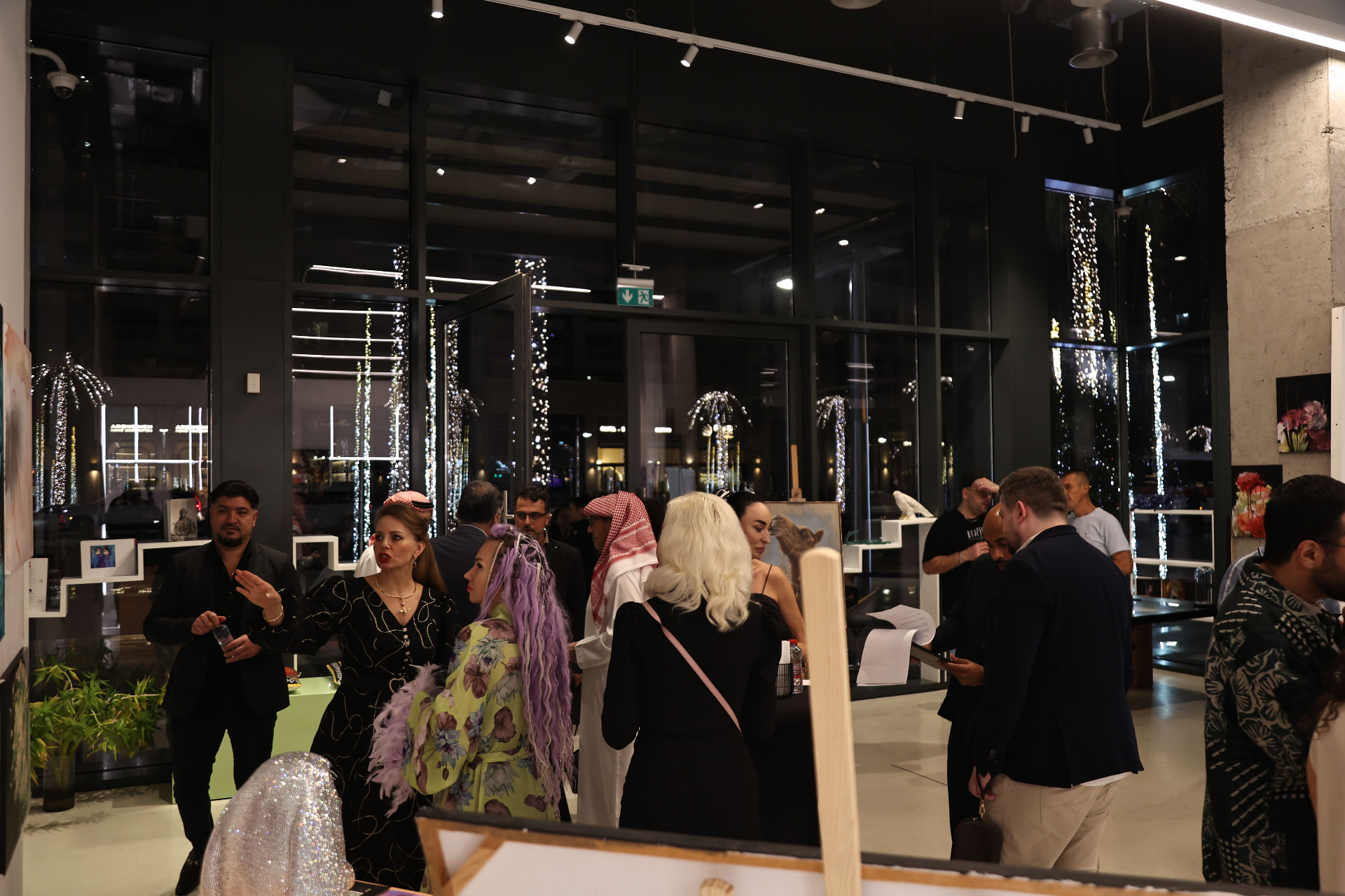 Guests viewing artworks during a private Art Elfouly reception